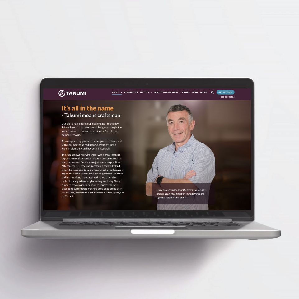 Takumi's about us website on laptop.