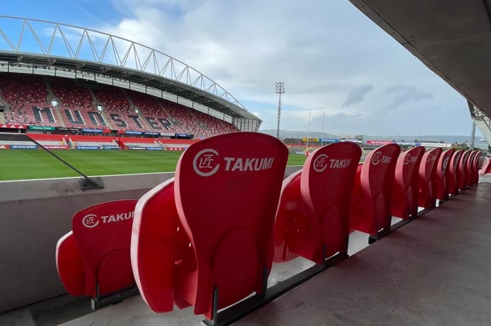 Takumi on the back of every chair in Thomond Park Stadium