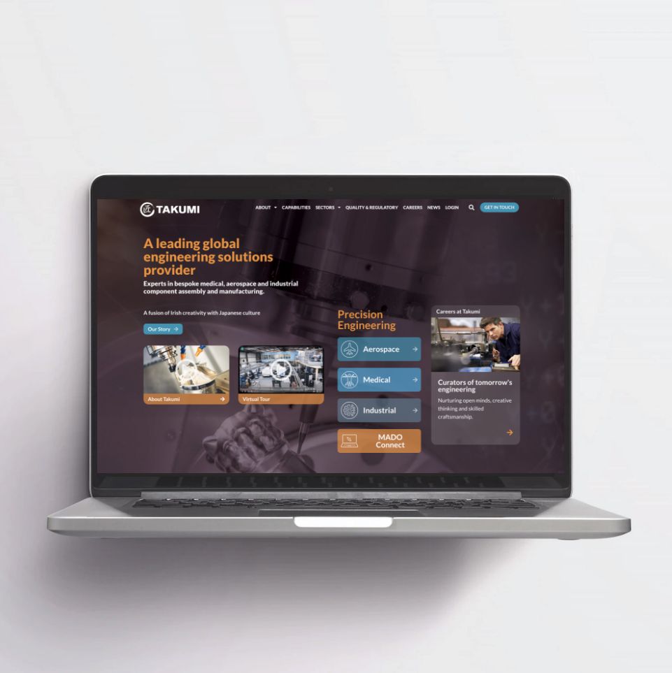 Takumi home page website on Laptop